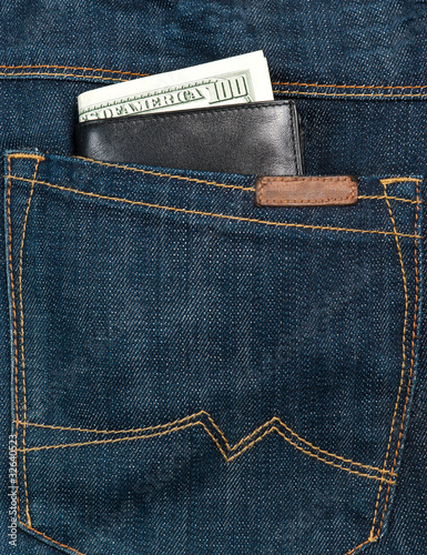 Wallet in jeans back pocket photo