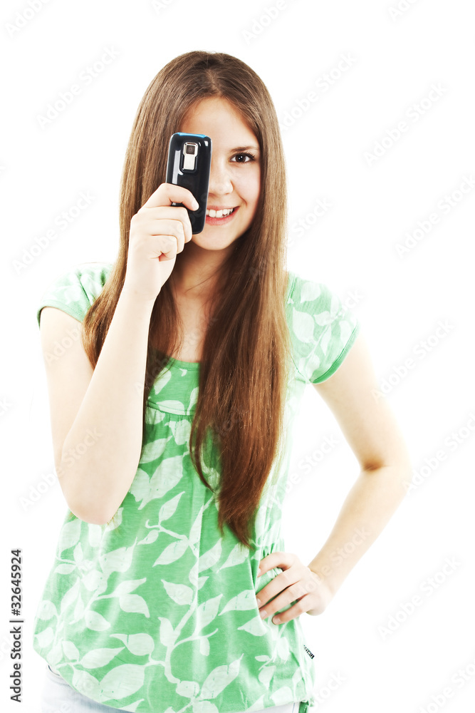 Teen girl using cell phone, isolated on white