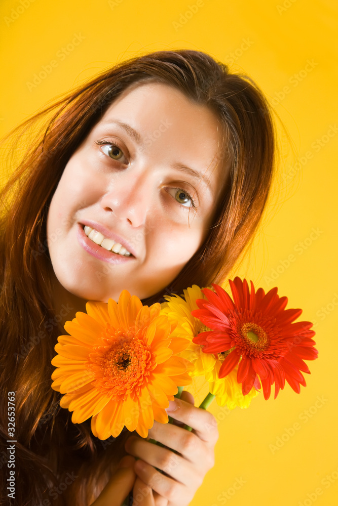 girl with flowers on yellow