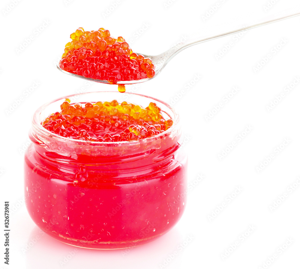 Red caviar on spoon isolated on white Red caviar on spoon isolated on white