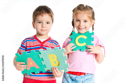 boy and girl holding letters