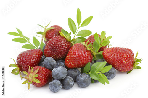 Strawberries and blueberries isolated on white