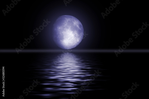 Fototapeta Naklejka Na Ścianę i Meble -  The full moon in the night sky reflected in water
