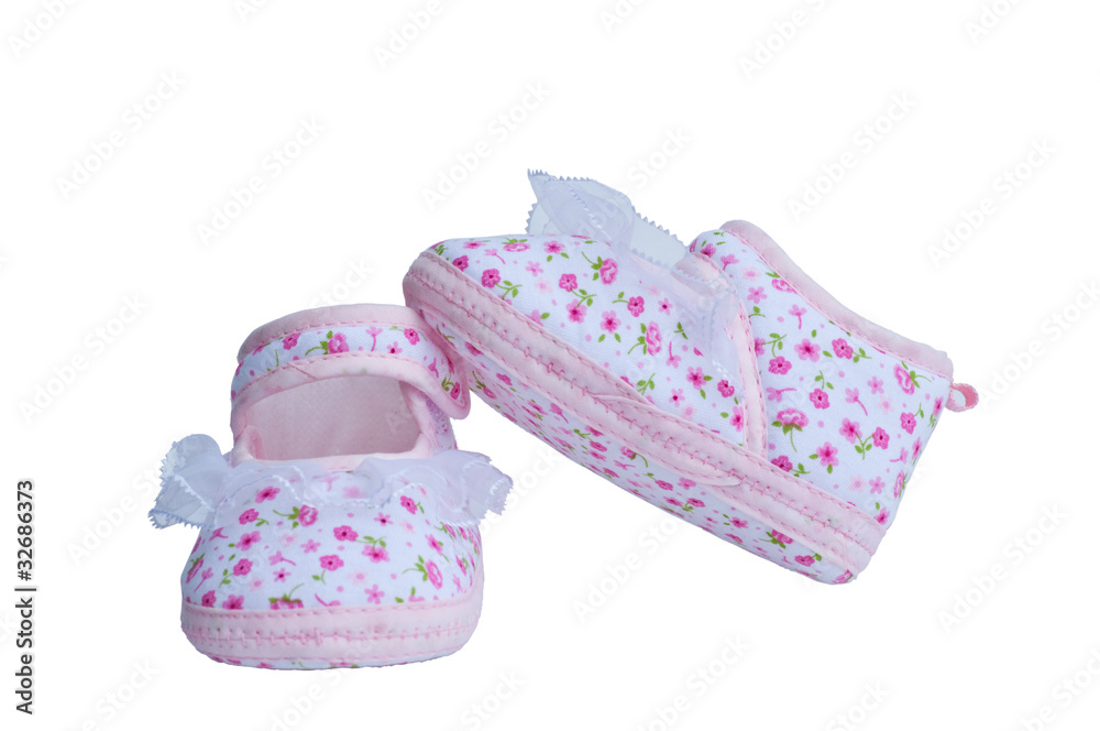 Handmade baby booties on white background Handmade baby booties on white background