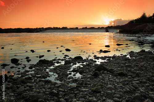 A river at sunset photo