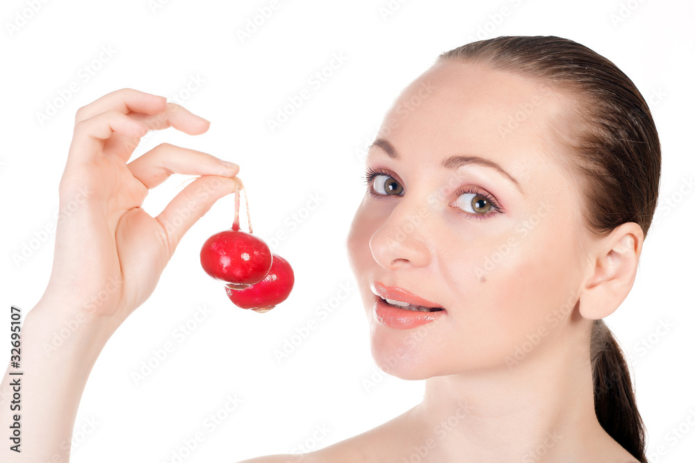 Pretty model holding radishes close to lips Pretty model holding radishes close to lips