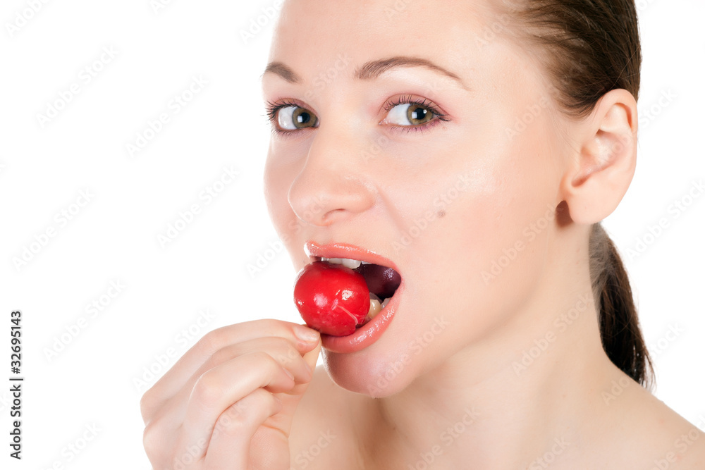 Pretty model holding radishes close to lips Pretty model holding radishes close to lips