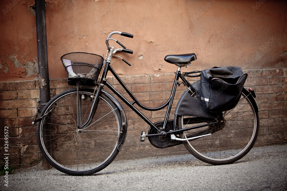 Old retro bicycle with basket in Italy Old retro bicycle with basket in Italy
