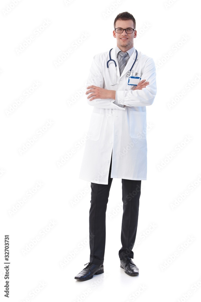 Confident young doctor smiling arms crossed Confident young doctor smiling arms crossed
