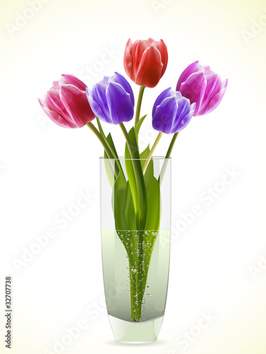 Fototapeta Naklejka Na Ścianę i Meble -  Tulips in a glass vase on a white bacgkround