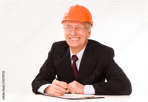 old builder in the helmet