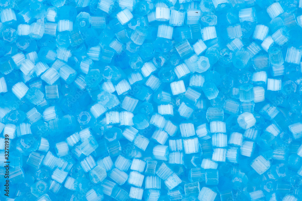 background of blue decorative plastic craft beads background of blue decorative plastic craft beads