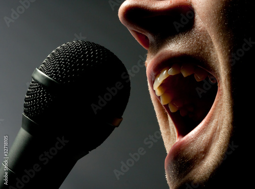 Man singing to microphone