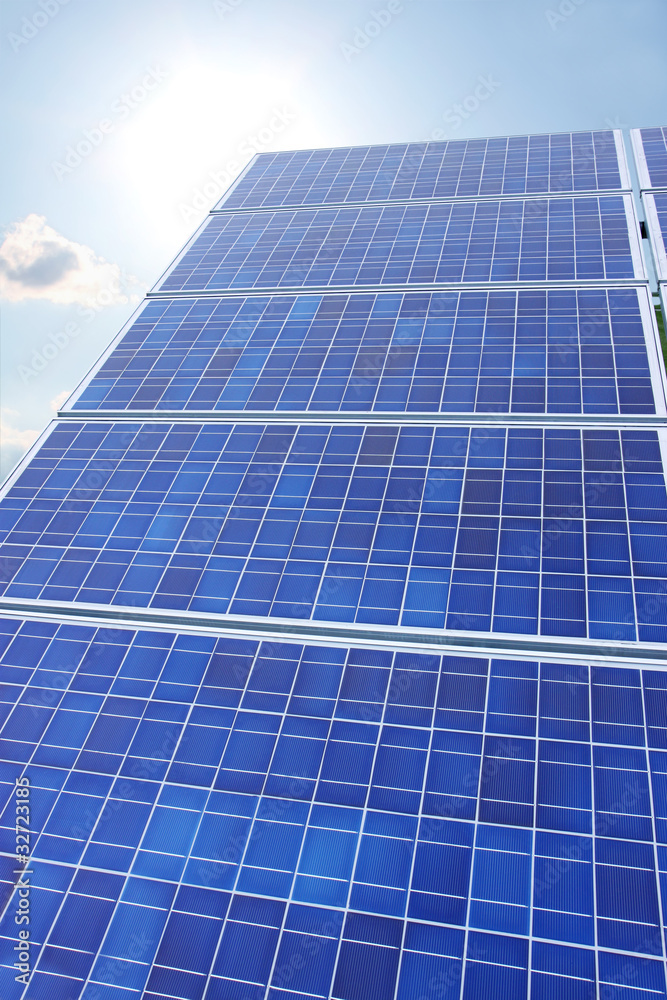 Solar panels sun and sky vertical Solar panels sun and sky vertical