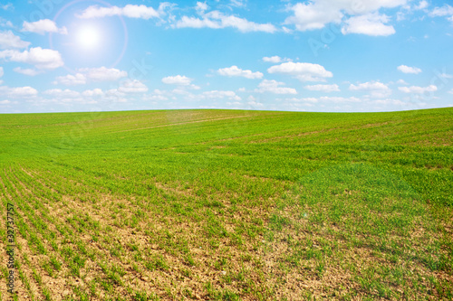 green hill, in blue sky