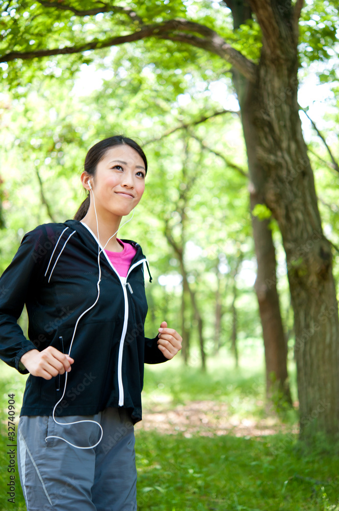 beautiful asian woman jogging in the park beautiful asian woman jogging in the park