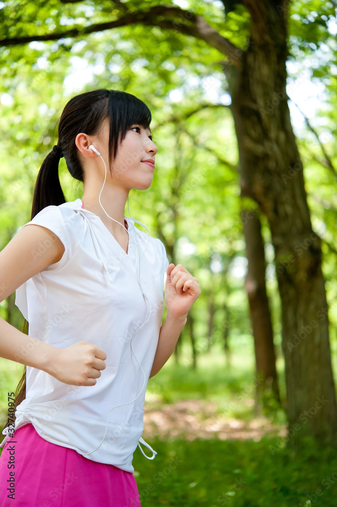 beautiful asian woman jogging in the park beautiful asian woman jogging in the park