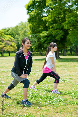 beautiful asian women exercising in the park © taka