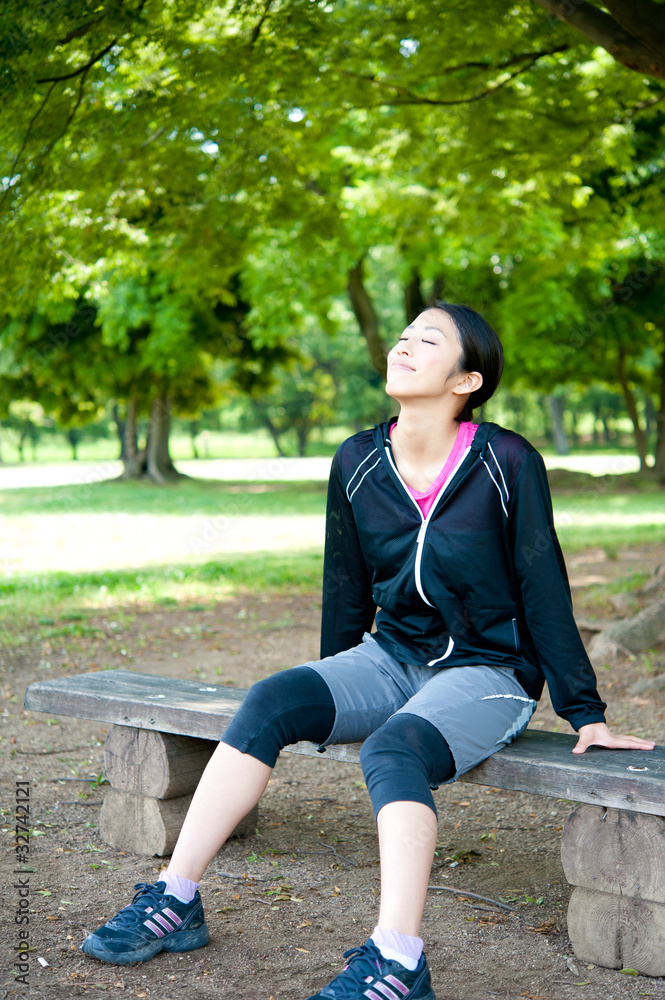 beautiful asian woman relaxing in the park beautiful asian woman relaxing in the park
