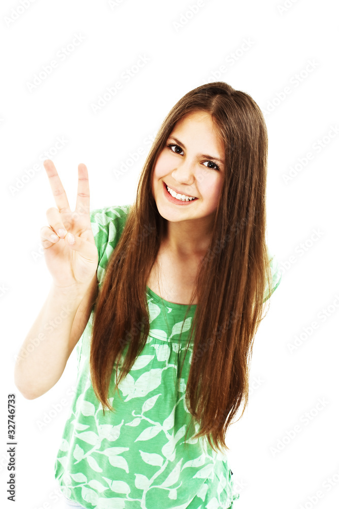 Happy young teenager girl showing victory sign Happy young teenager girl showing victory sign