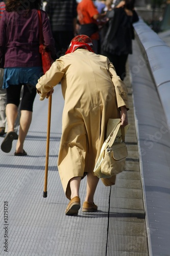 old lady crossing a bridge