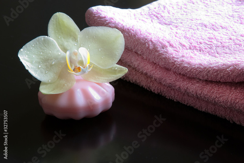 white orchid, soap and towel