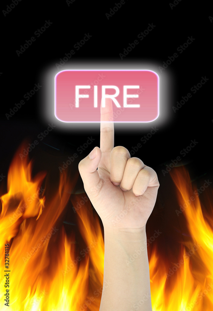 hand pressing fire button on fire background hand pressing fire button on fire background