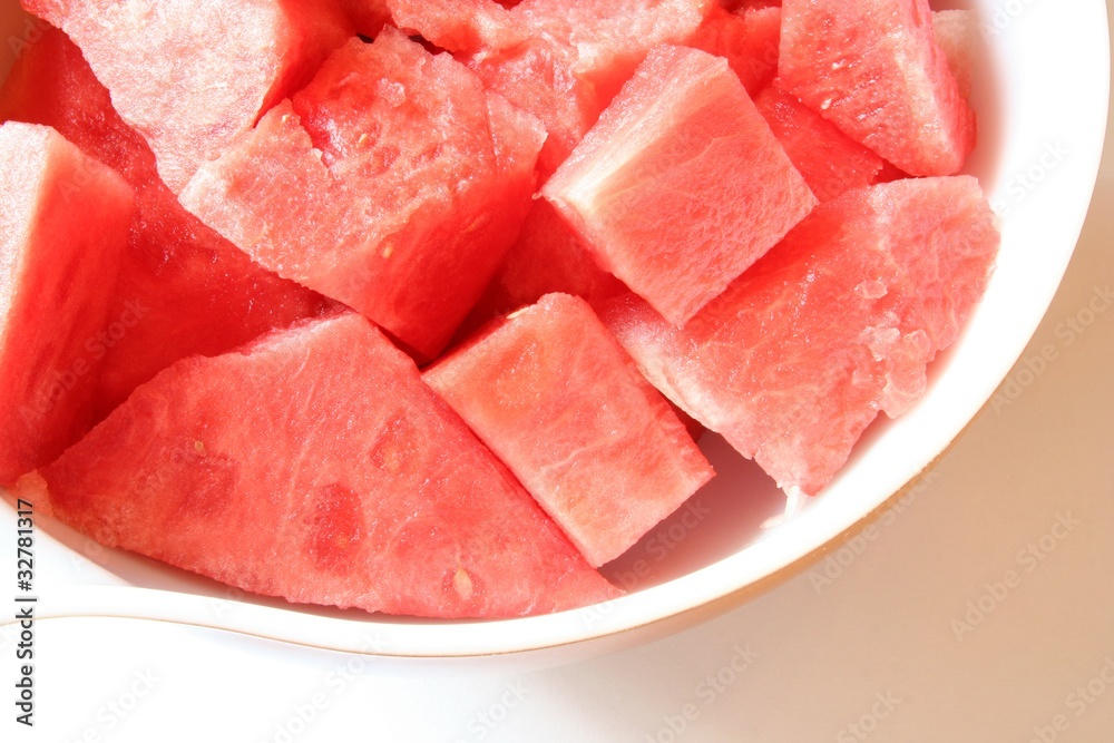Watermelon chunks in a white bowl Watermelon chunks in a white bowl