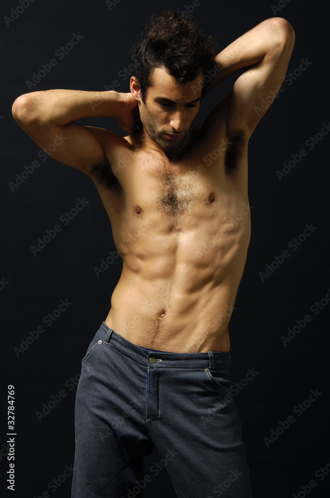 Fototapeta premium Sport and health body of young man on black
