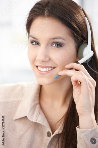 Attractive customer servicer smiling