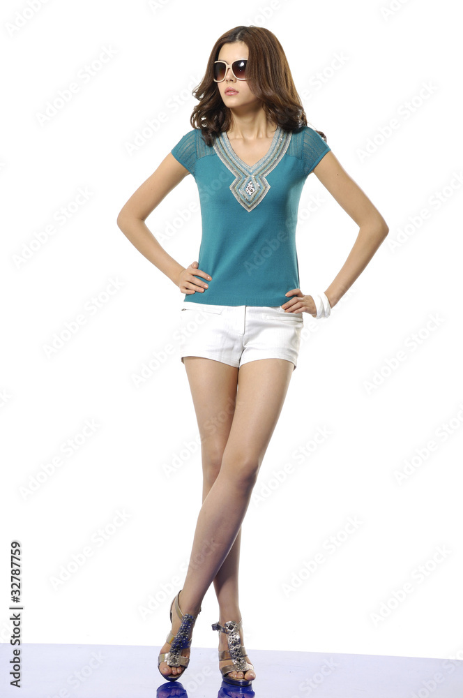 Fototapeta premium Portrait of cute young lady posing with sunglasses