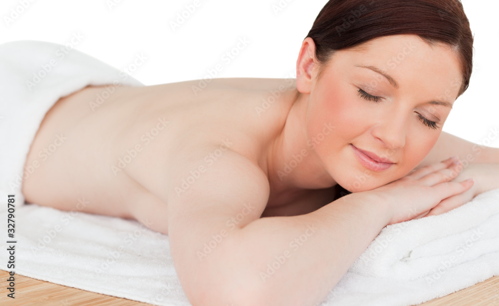 Charming pretty red-haired female relaxing in a spa centre Charming pretty red-haired female relaxing in a spa centre
