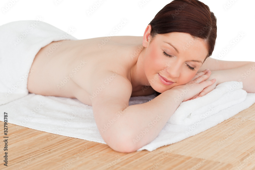 Young pretty red-haired woman relaxing in a spa centre Young pretty red-haired woman relaxing in a spa centre