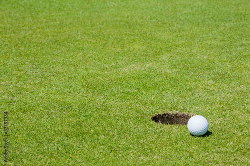 Golf ball close to hole