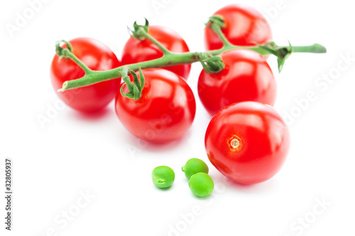 bunch of tomato and peas isolated on white