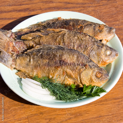 Fried fish crucian in plate