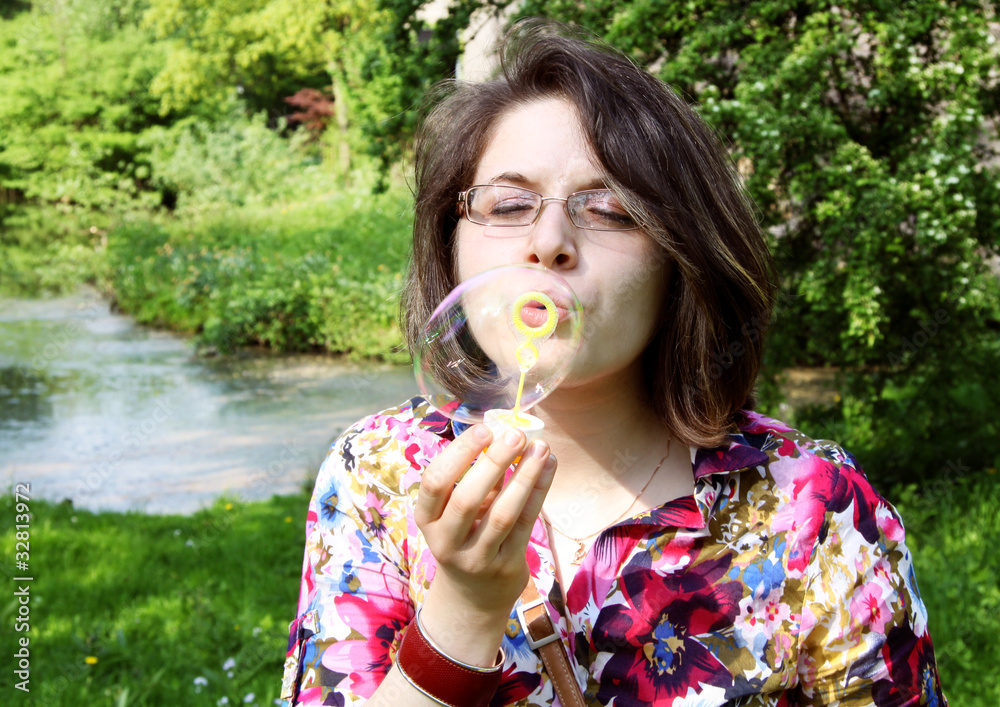 girl making soap bubbles girl making soap bubbles
