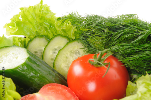 green salad and tomato isolated on the white background