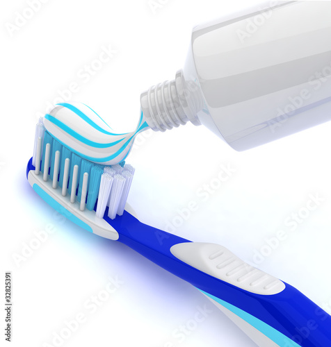 Squeezing toothpaste onto toothbrush