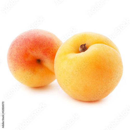 Apricot fruits with leaves isolated on white background.