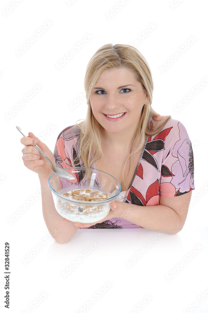 beautiful female having muesli cereals for breakfast. isolated o beautiful female having muesli cereals for breakfast. isolated o