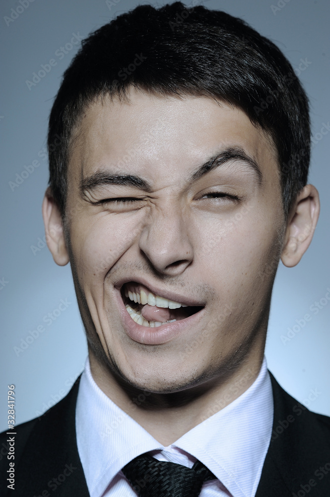 Portrait of funny business man in formal suit and black tie . ex Portrait of funny business man in formal suit and black tie . ex