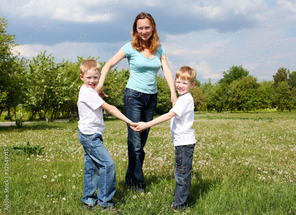 mother with her two sons outdoors mother with her two sons outdoors