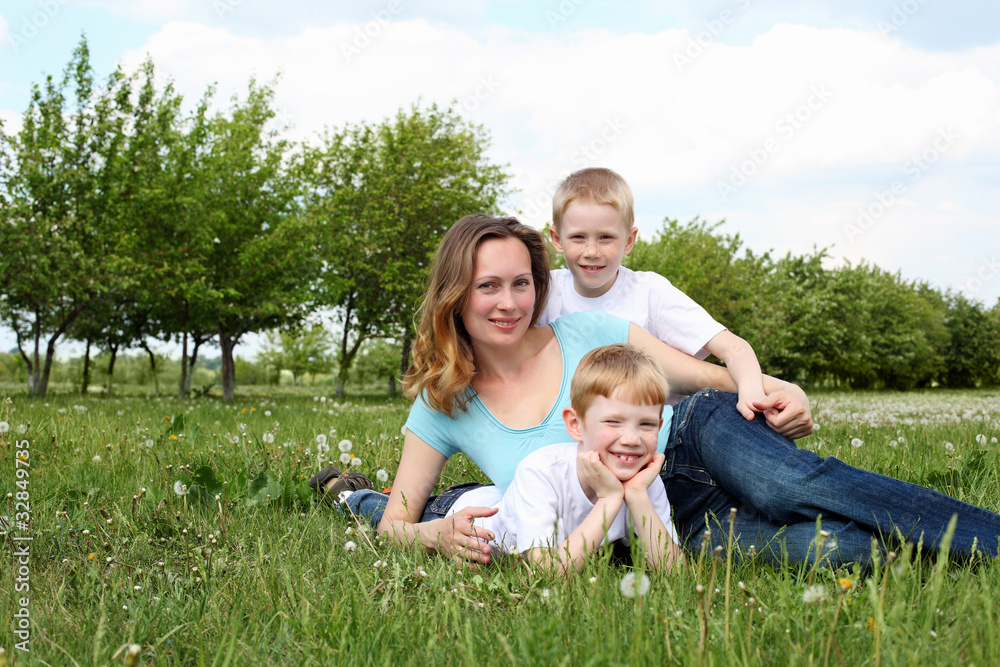 mother with her two sons outdoors mother with her two sons outdoors
