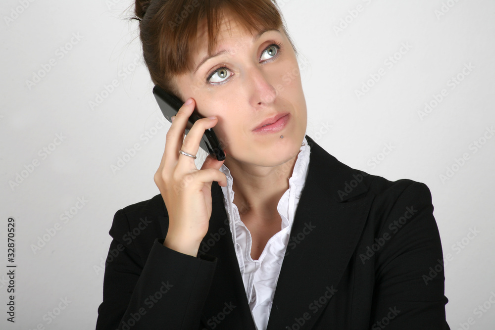 Young businesswoman speaking at the phone Young businesswoman speaking at the phone