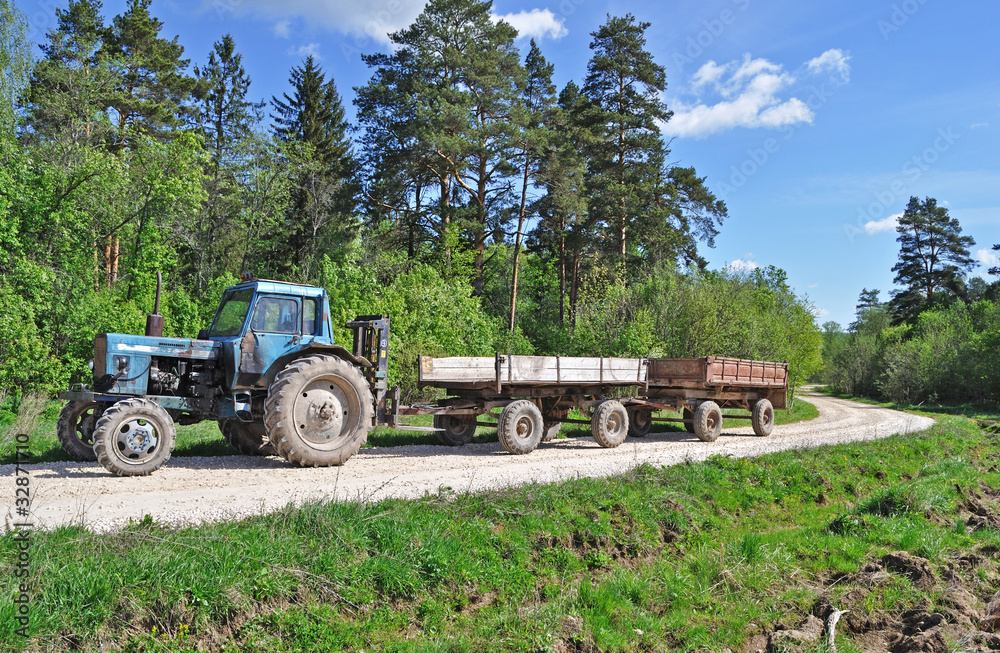 Tractor with trailer on country road Tractor with trailer on country road
