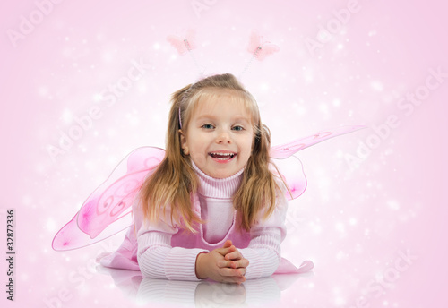 Cute girl in fairy costume on white