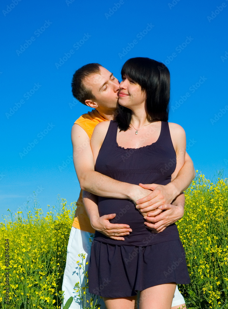 couple kissing on the field couple kissing on the field