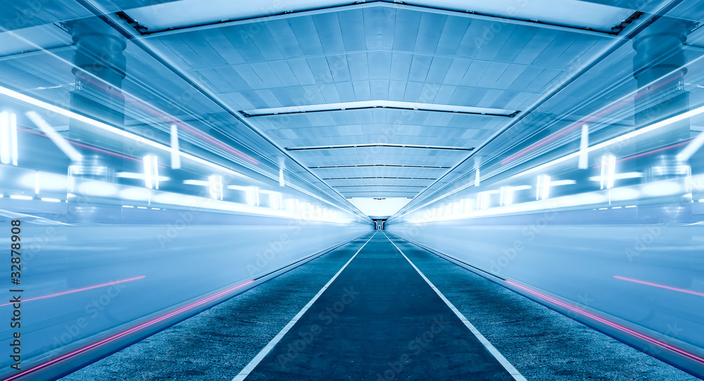 illuminated modern metro station with train motion