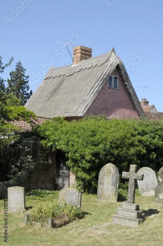 Almshouses and graveyard in Thaxted, Essex photo